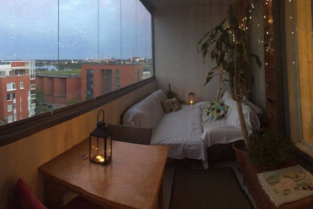 The balcony facing southeast and the sea. By opening the glass window you can let the fresh sea wind blow in.
