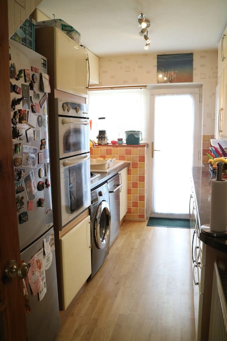 Kitchen with fridge/freezer, dishwasher and washing machine