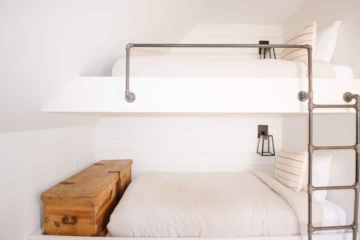 The Bunk Room - two twin beds built sturdy enough for kids & adults! A few small toys & children's books are stored inside the trunk but we recommended to bring your own favorites for kids.