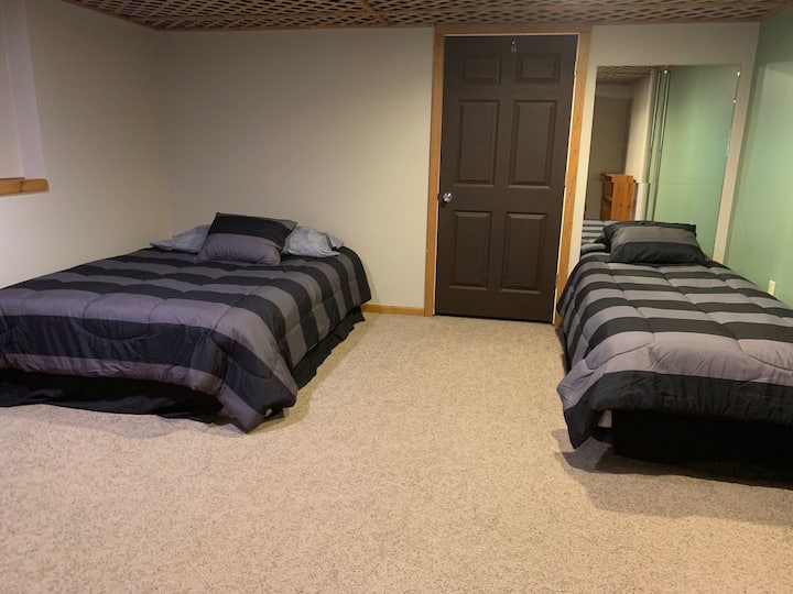 Bedroom in basement, one queen size bed and one twin size bed