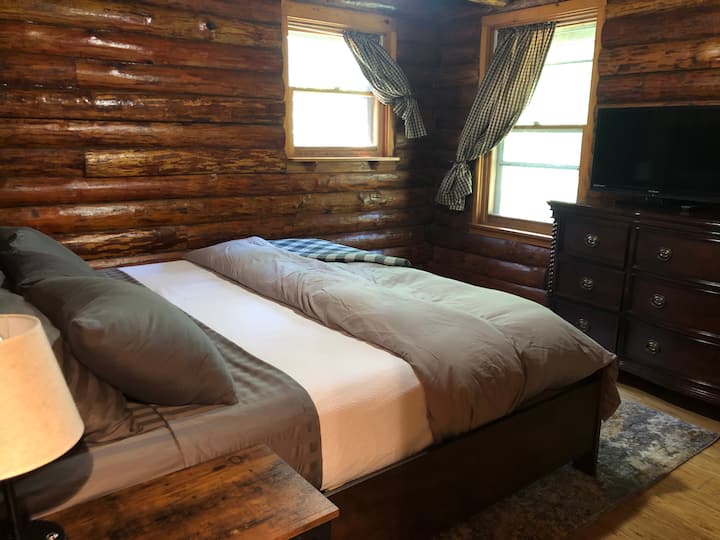 Master bedroom, California king size bed with a purple mattress 