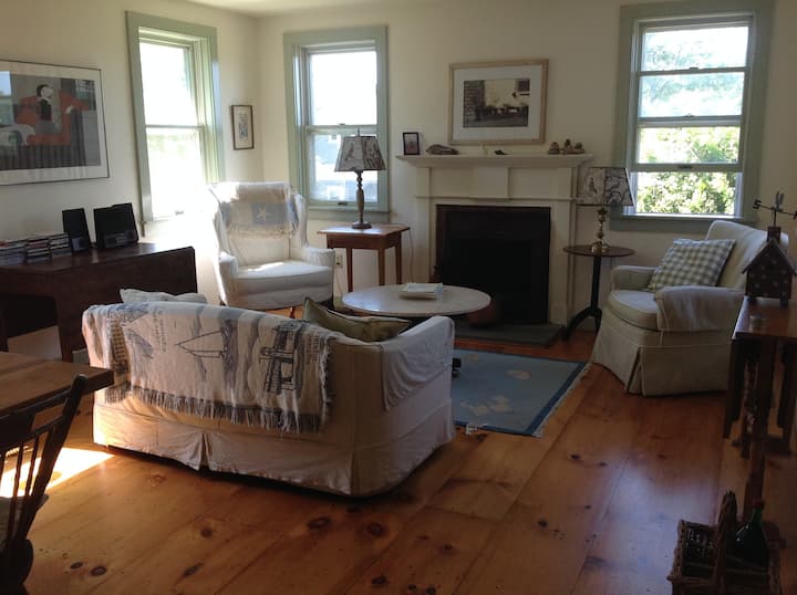 Dining room (table to left) and sitting area with fireplace