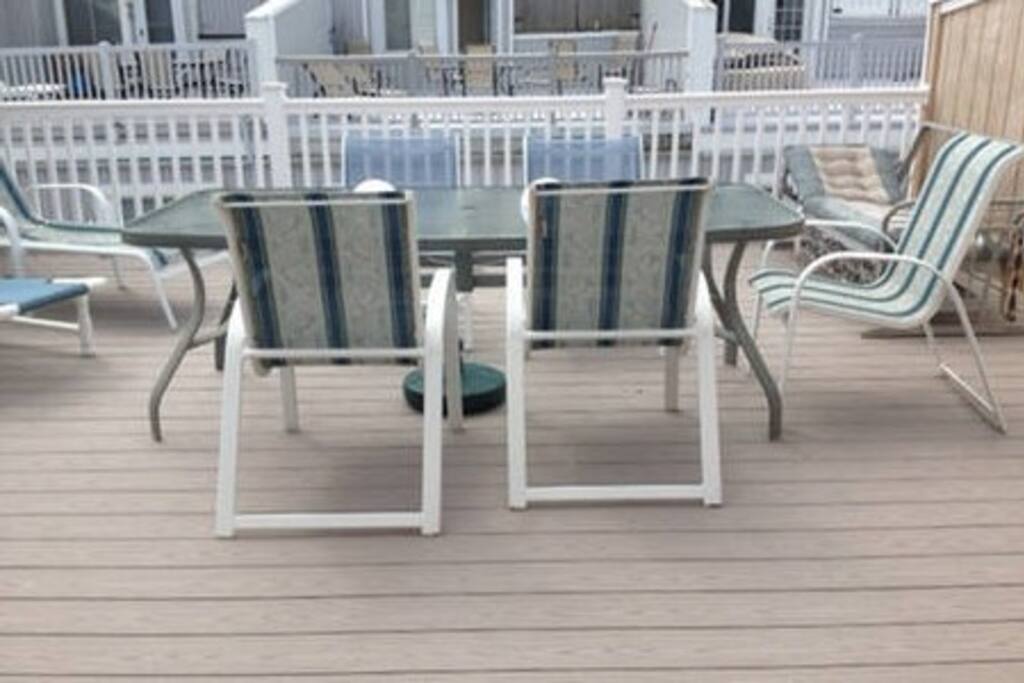 Roof deck with chaise and table for 8. One of 4 decks.