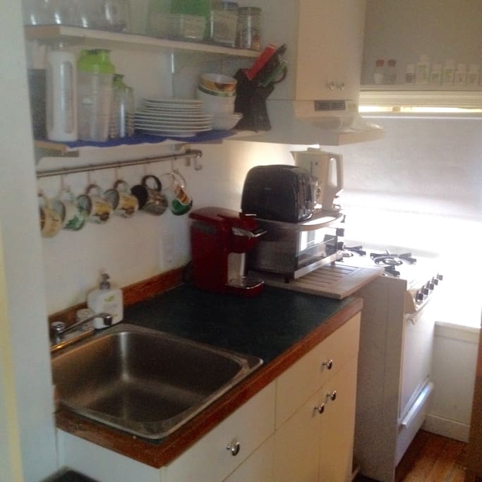 You are welcome to use any dishes and appliances. Stove top is gas. Please don't use the oven. There is also a microwave that is not pictured.