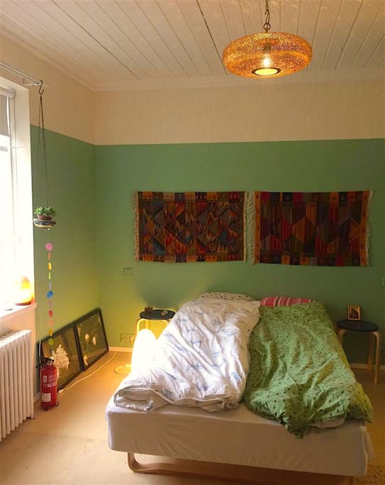 Large bedroom with a double bed on the quiet garden side