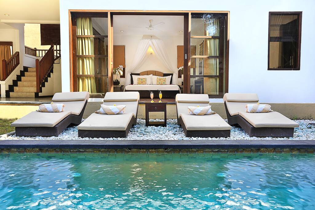 Sun loungers beside the pool
