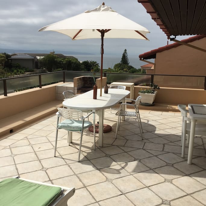 Balcony with built in barbeque and outside dining table