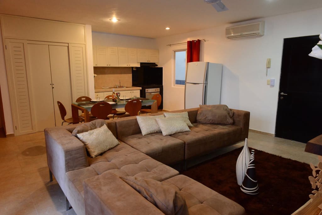 Main area with living room, dining area and kitchen