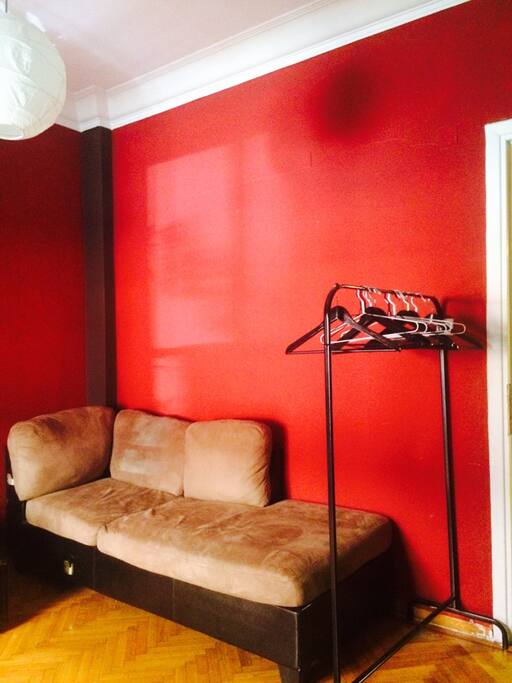 Single bed room, with extra sofa, desk, balcony