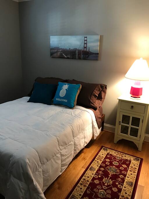 Comfortable full sized bed gets early morning sun after a good nights sleep