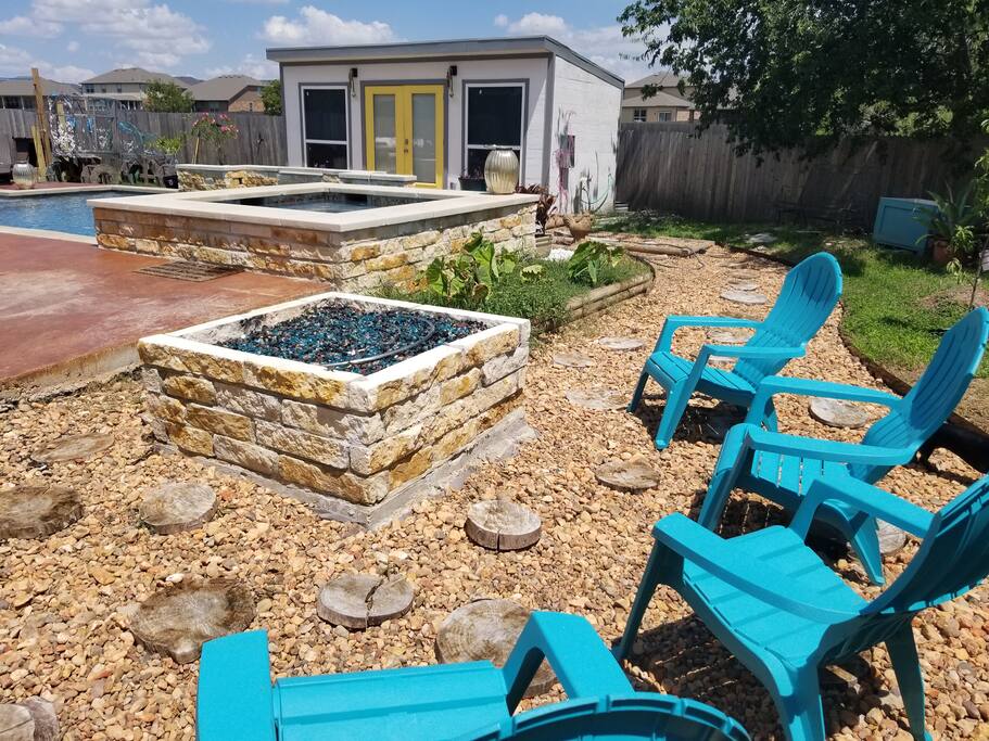 Huge gas fire pit for enjoying a glass of wine by at night.