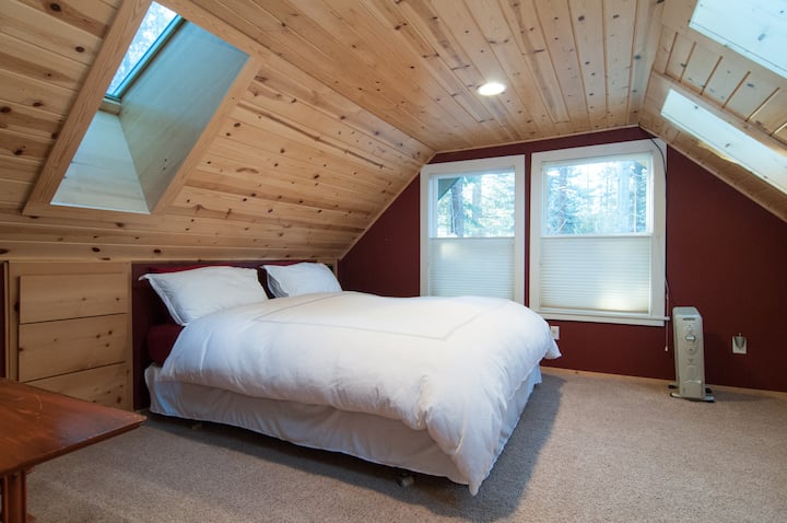 Upstairs bedroom #1 with comfy Cal-King bed and lots of sky lights for natural lighting