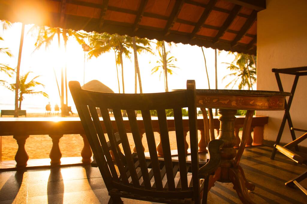 A cup of coffee, a book, rays of the setting sun, shimmering beach waters, stretch of a sand.. the ingredients for complete rejuventation