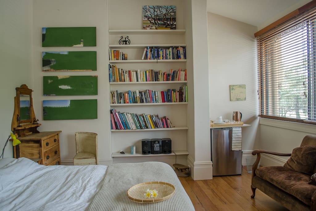 dressing table and chair, bookshelves , stereo , fridge, couch and kettle
