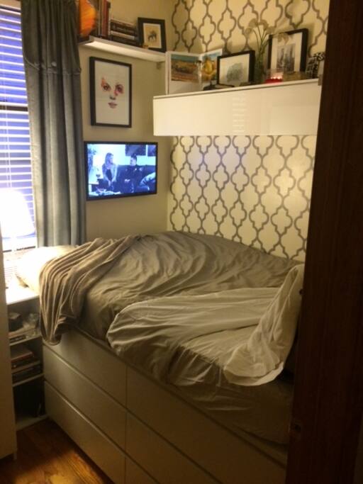 Bedroom: Full sized bed and flat screen TV connected to Apple TV