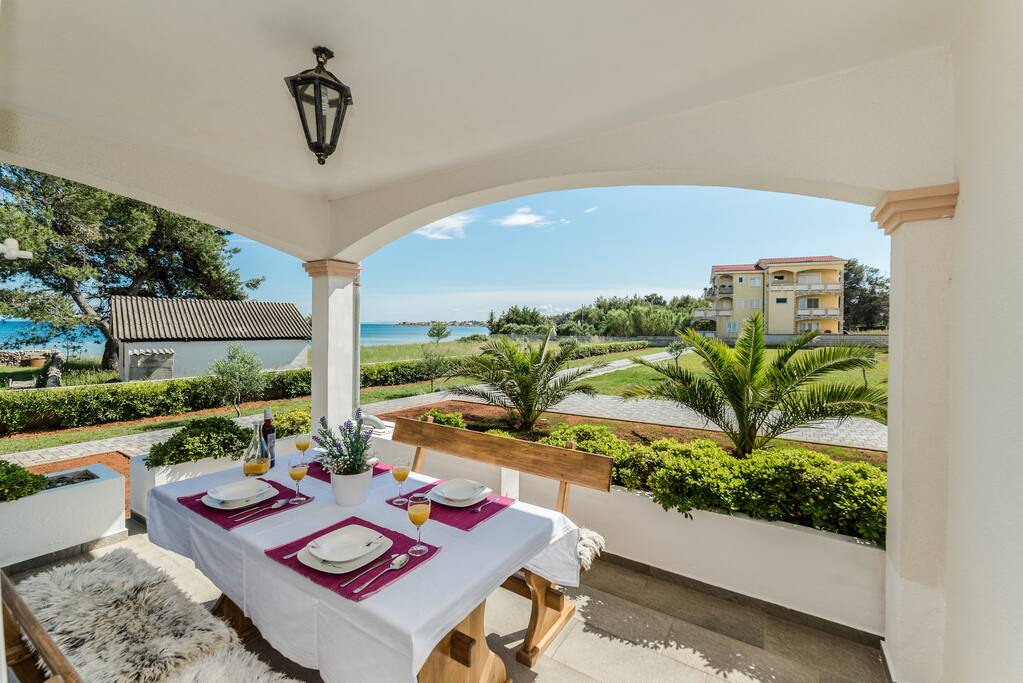 Roofed apartment terrace with a sea view