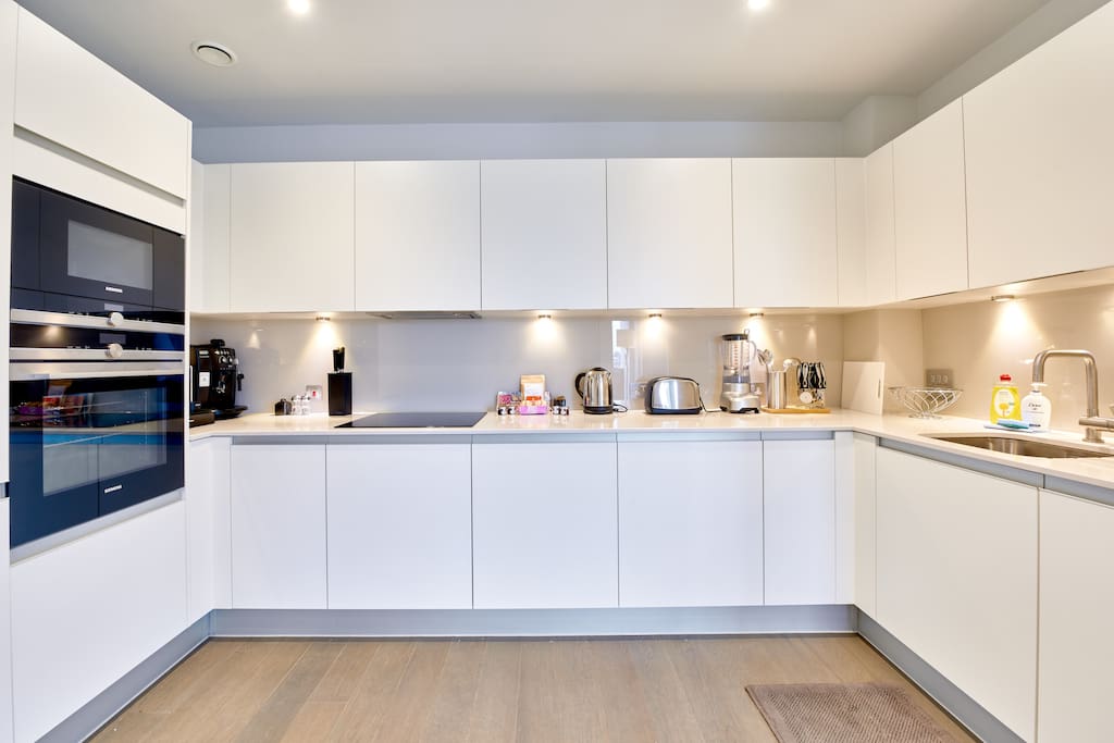 The sleek kitchen has everything you need, with mod cons and plenty of storage space