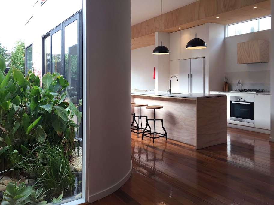 Curved glass wall overlooking fish pond