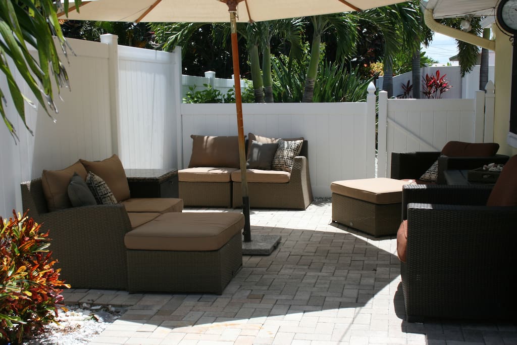 Shaded lounge area next to the pool.