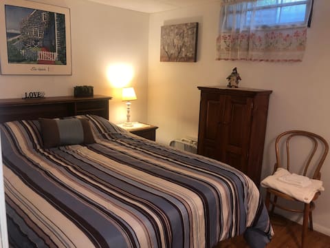 Private basement guest room in a cozy home