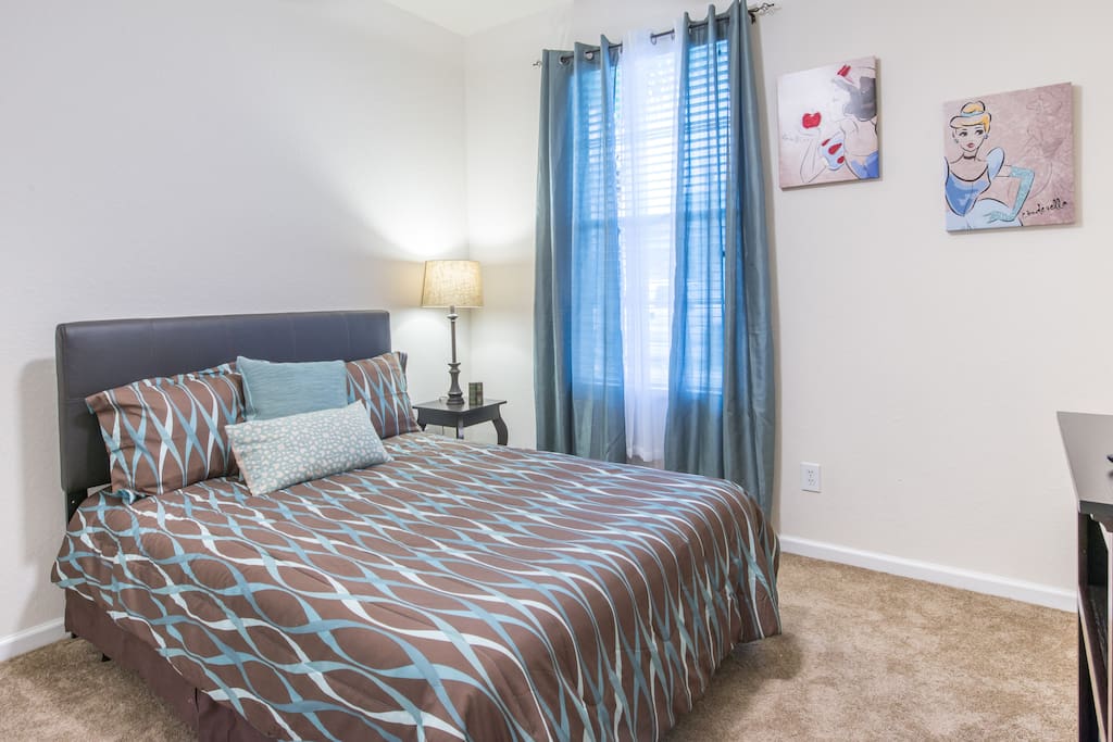 3rd bedroom with full-sized bed and double door closet