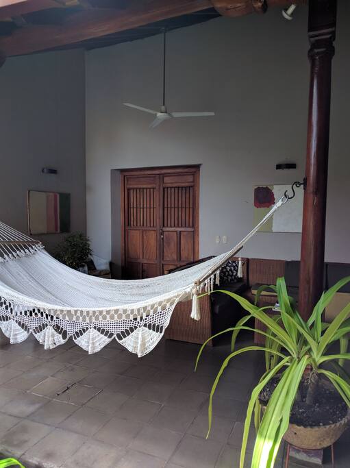 Big comfortable hammock for lounging near pool.