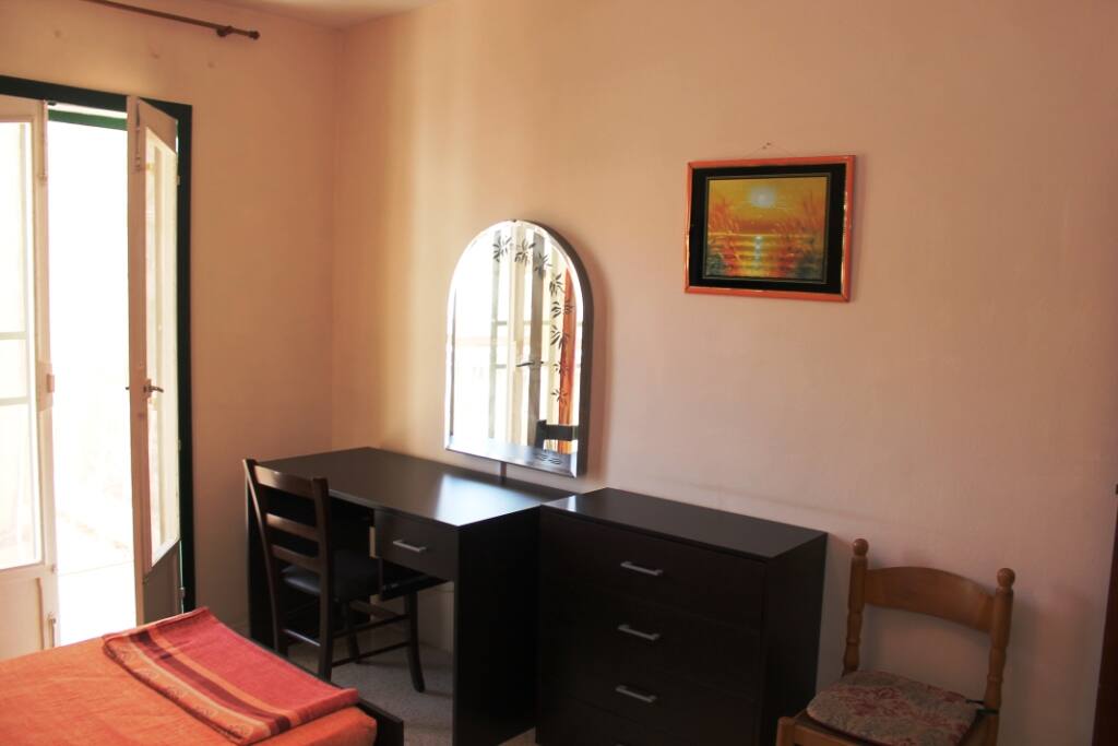 Main bedroom with vanity and chest of drawers