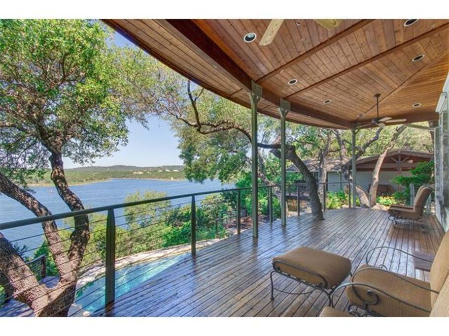 Main deck above the pool & hot tub with panoramic lake views