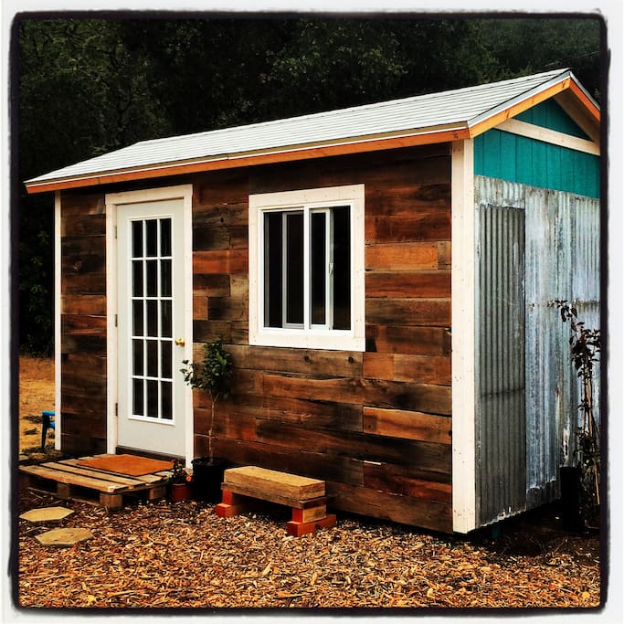 we call it "the wellhouse" because it's sitting (almost) on top of our 500 foot deep well. we are grateful for water!