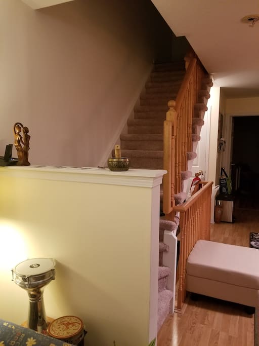 Stairs going up from living room to your room (and our room) + both bathrooms