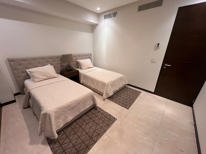 Secondary room:
** 2 Single beds, 
** Closet, 
** Ceiling Fan and Integral Air Conditioning.