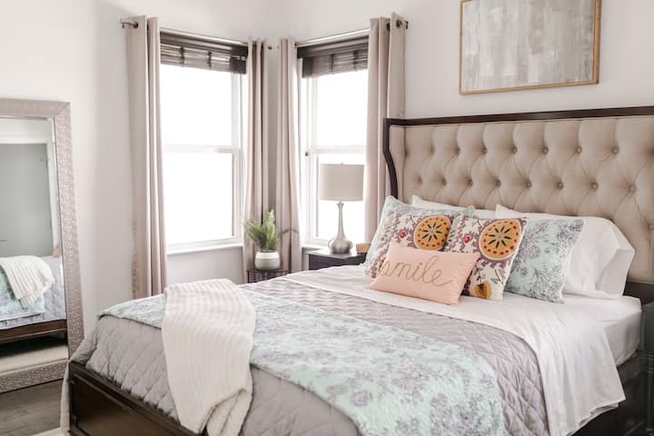 Beautiful guest suite with queen bed in Bedroom #1. This bedroom also has a TV equipped with a chrome cast.