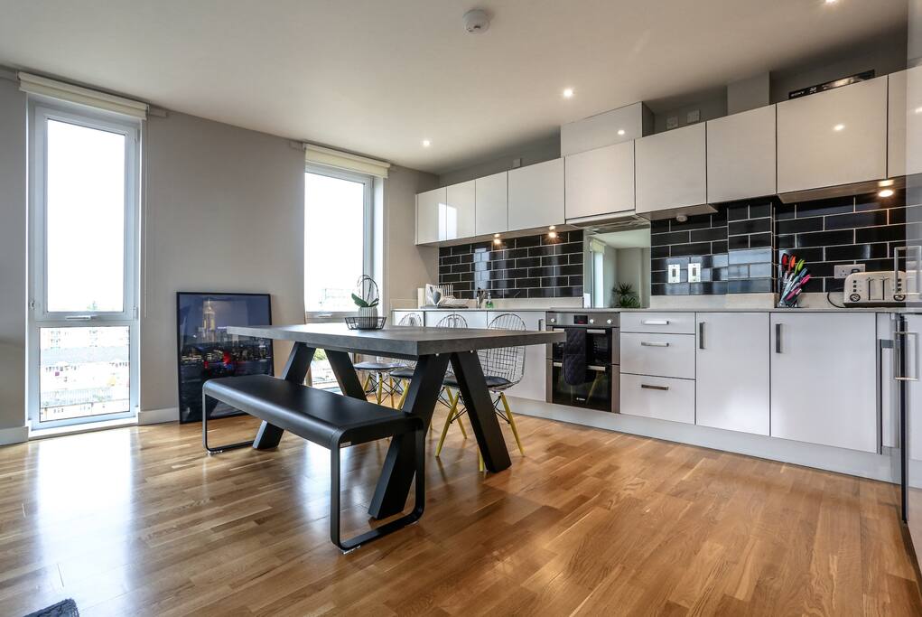 Open plan kitchen with large dining table