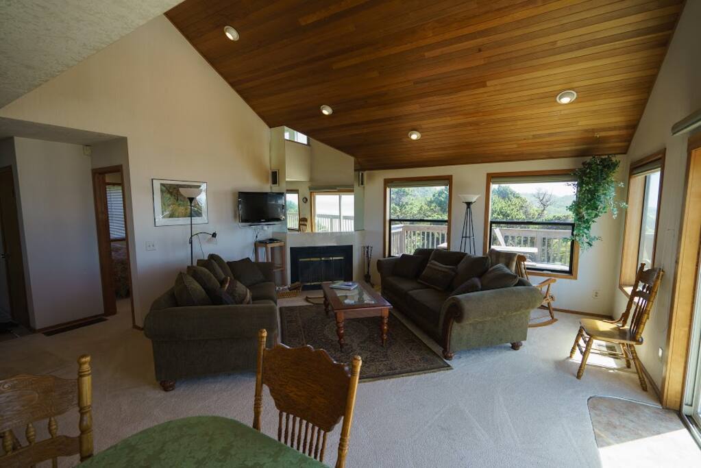 Living room with cozy fireplace and TV