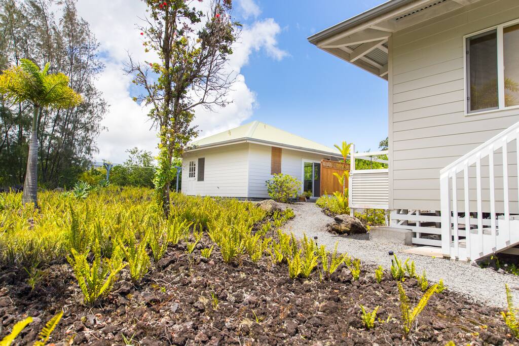 Your path to the cottage, past the owner's house and shared outdoor shower.