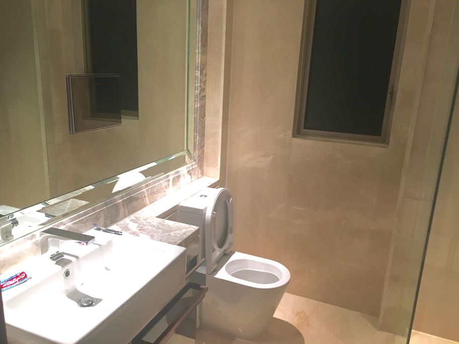 Bathroom with LED TV in mirror.