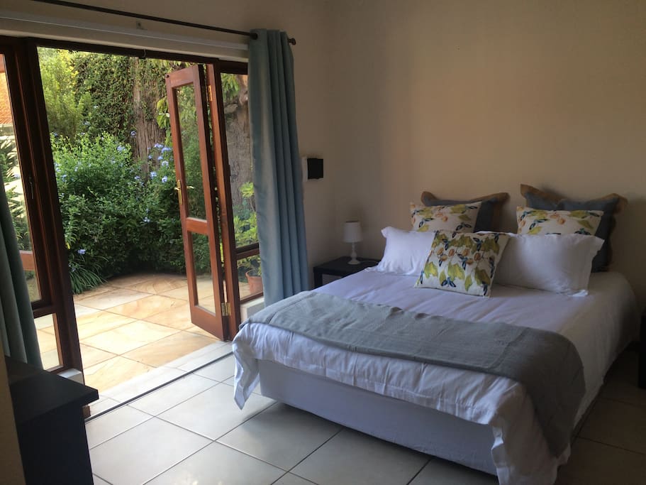 tranquil, private bedroom opens onto lush garden