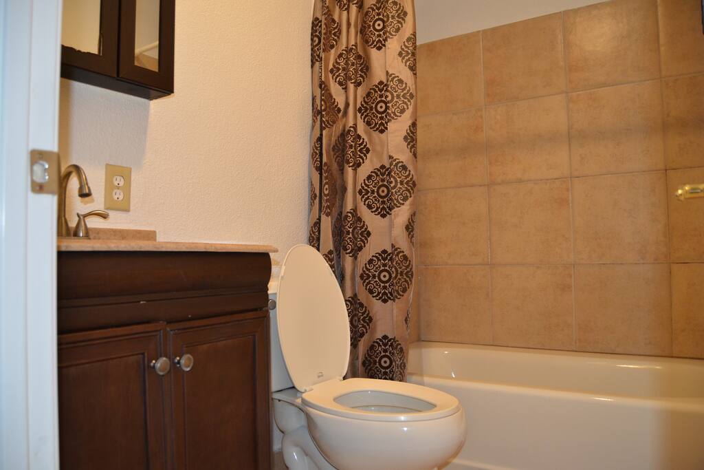 Full bathroom with tub and shower