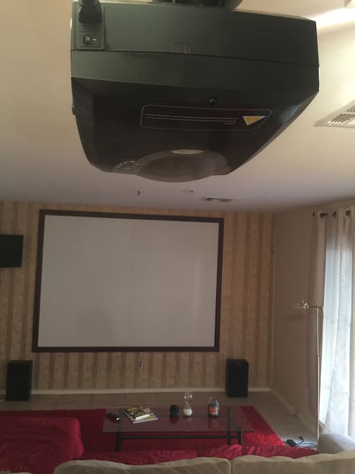 Living room w projector and ginormous screen!