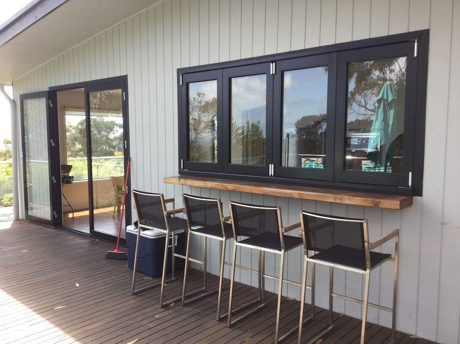 Windows open up to a bar on the rear deck