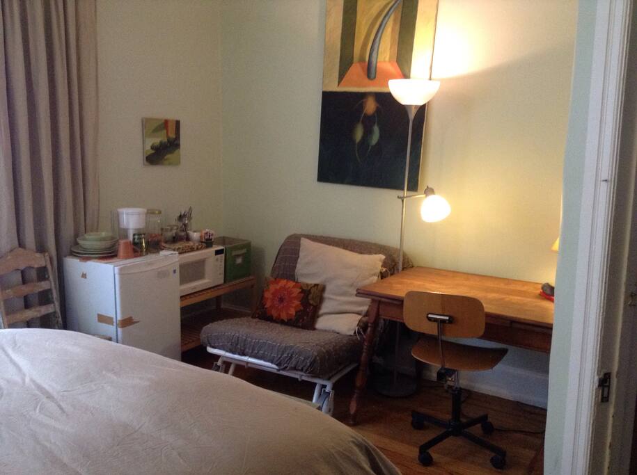 The antique table on the right makes a great spot to enjoy a quick meal or get some work done.