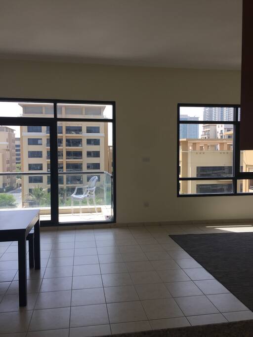 View from the kitchen to the dinning/living room and common balcony.