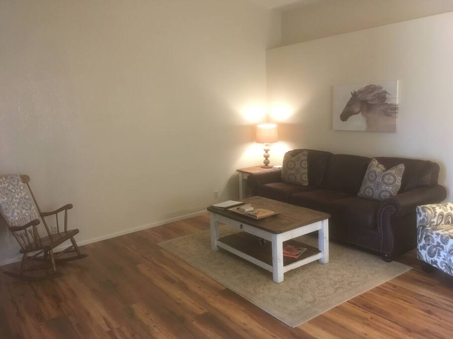 The living room is comfy and cozy for a evening of relaxation