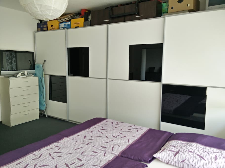 Sleepingroom with two big cupboards.