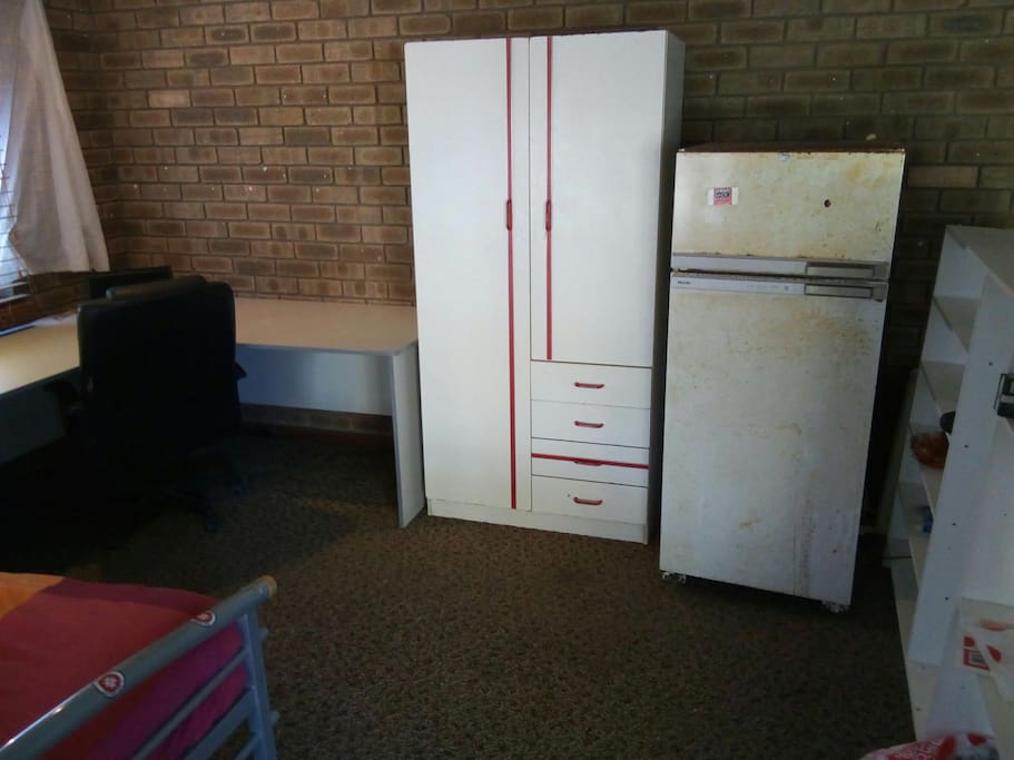 Big corner desk, private wardrobe and shared fridge