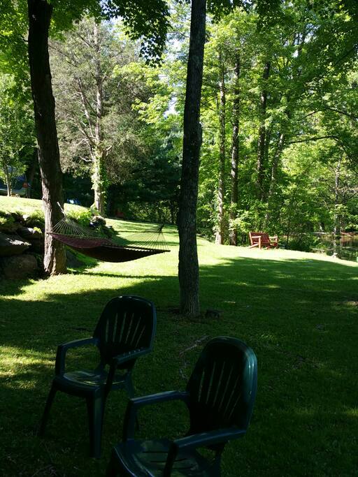 sitting area by lake with campfire pit