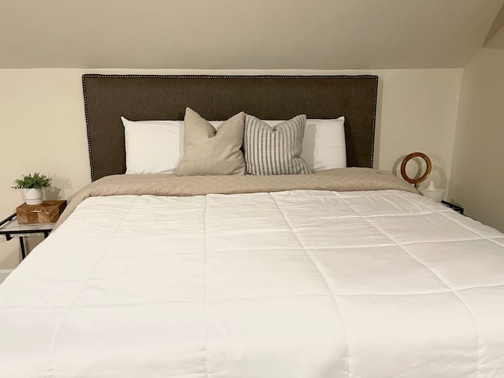 Bedroom on second floor offers a comfortable king size bed and smart TV