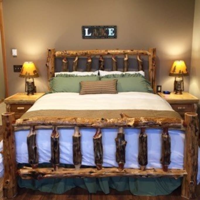 Sleep well on a King sized, pillow top mattress and custom made log bed