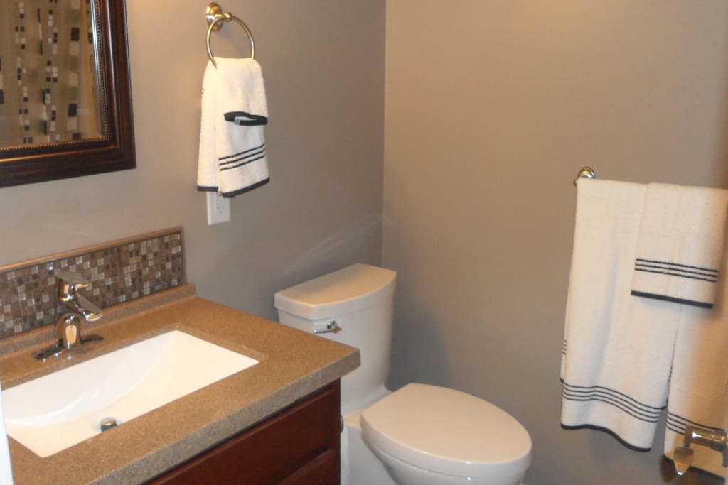 Private Bathroom off bedroom with soaker tub and heated tile floor