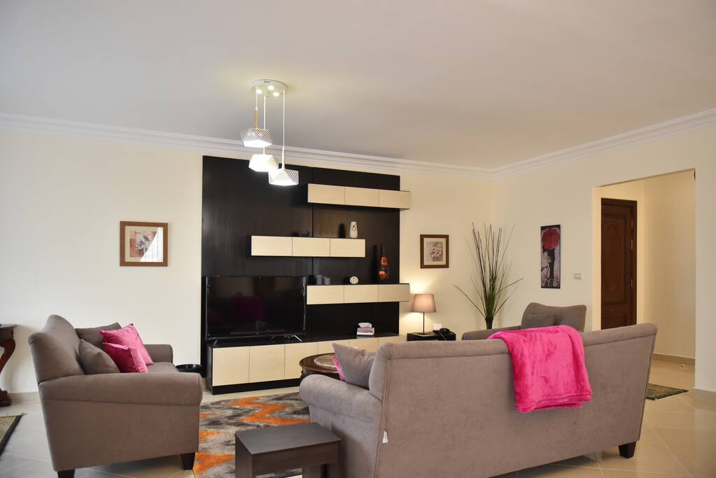 Another shot of living area, showing entry door